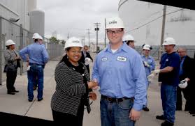 Oletha celebrates with Cargill management at the start of a new plant expansion she helped make happen.